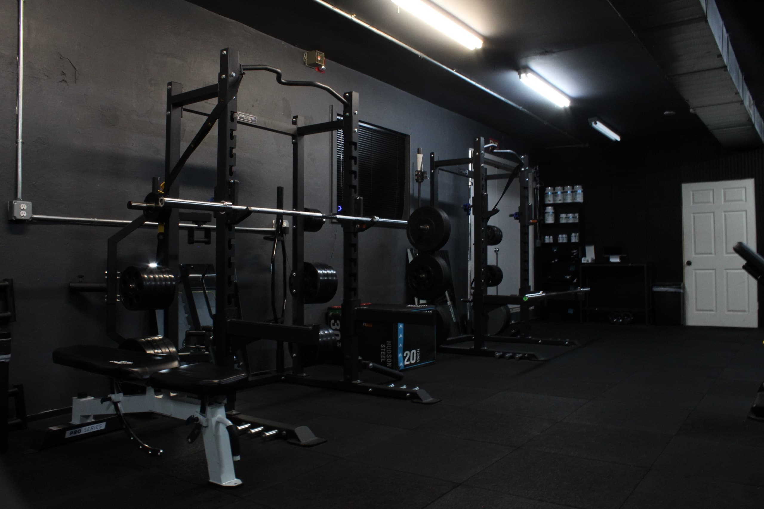 Squat racks and free weights at the BAM Fitness studio in Bergen County, NJ
